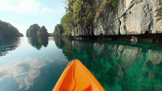 Kayak Under the Cliffs, El Nido, Palawan, Philippines