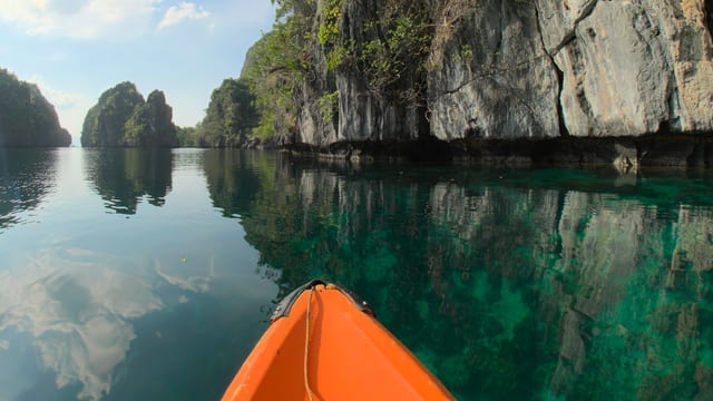Kayak Under the Cliffs, El Nido, Palawan, Philippines