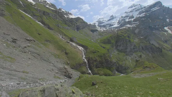 Waterfall Beneath the Peaks, Switzerland